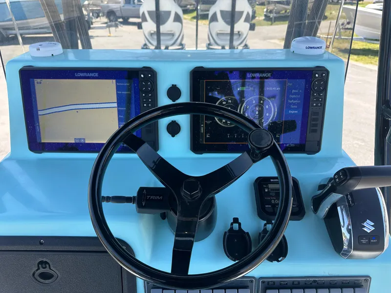 Slide: The Image of Dashboard of 2024 Shallow Master 270 SMC boat with dual Lowrance displays. - 19