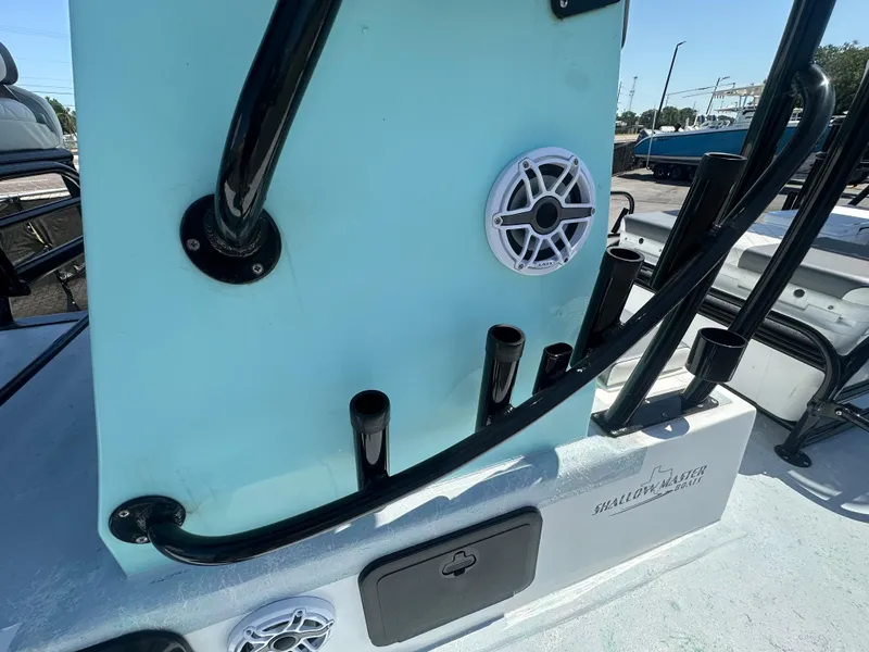Slide: The Image of 2024 Shallow Master 270 SMC boat with rod holders and speakers on deck. - 22