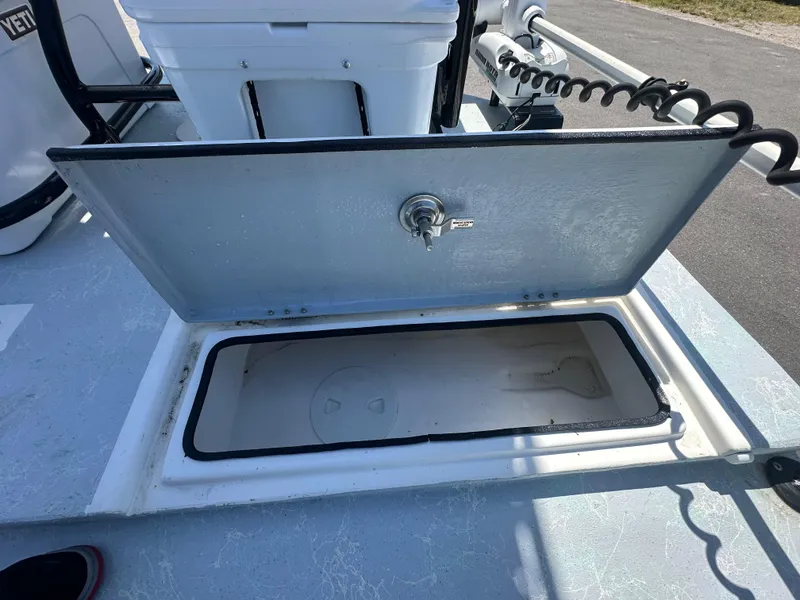 Slide: The Image of Open storage compartment on 2024 Shallow Master 270 SMC boat deck. - 28