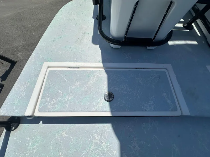 Slide: The Image of 2024 Shallow Master 270 SMC boat deck with storage compartment. - 29