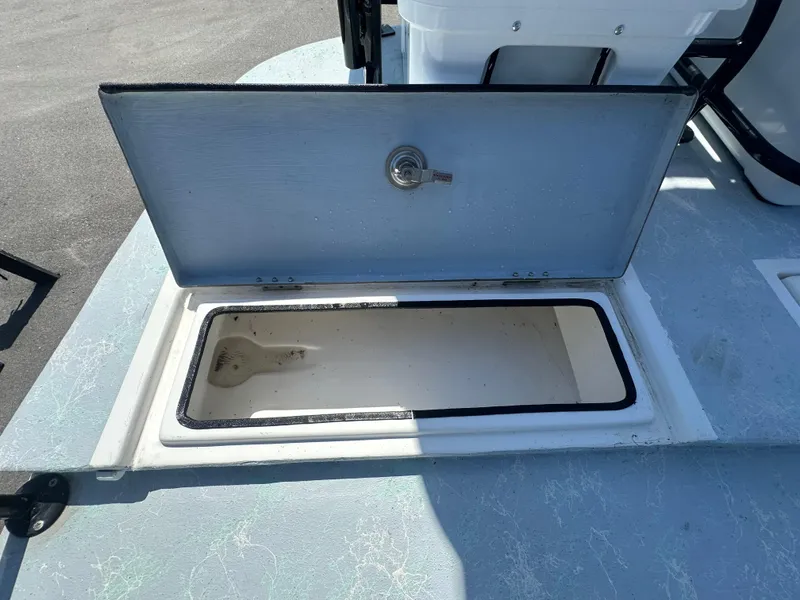 Slide: The Image of Open storage compartment on 2024 Shallow Master 270 SMC boat deck. - 30