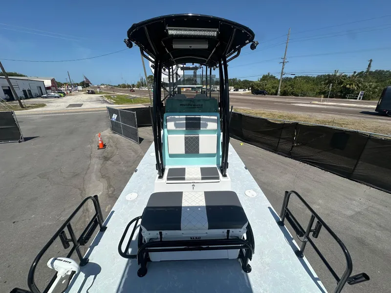 Slide: The Image of 2024 Shallow Master 270 SMC boat on display in outdoor setting. - 34