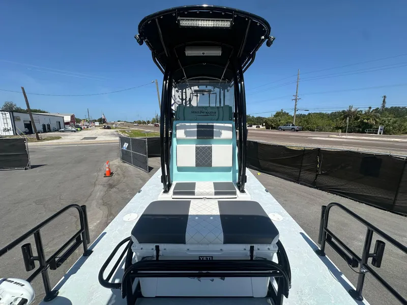 Slide: The Image of 2024 Shallow Master 270 SMC boat with sleek design and spacious deck. - 35