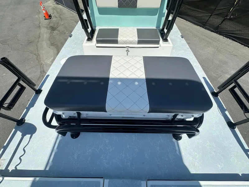 Slide: The Image of 2024 Shallow Master 270 SMC boat interior with cushioned seating and sleek design. - 38