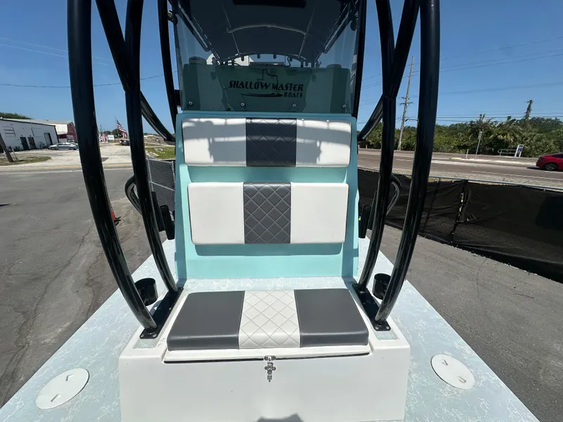 Slide: The Image of 2024 Shallow Master 270 SMC boat interior with cushioned seating and sleek design. - 40