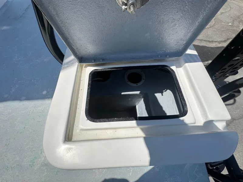 Slide: The Image of Open compartment on 2024 Shallow Master 270 SMC boat, showcasing storage space. - 47