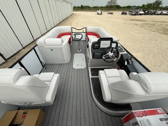 Slide: The Image of 2025 SunCatcher Elite 324 RC pontoon boat with spacious seating and modern helm. - 6
