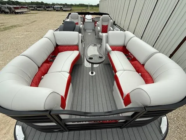 Slide: The Image of 2025 SunCatcher Elite 324 RC pontoon boat with spacious seating and modern design. - 9