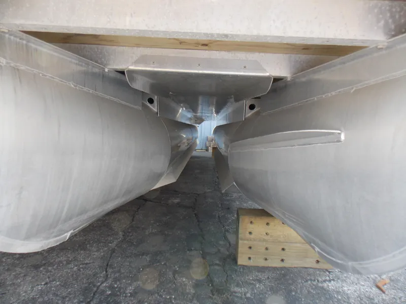 Slide: The Image of Underneath view of a 2022 Bennington SX 23 Quad Bench pontoon boat. - 23