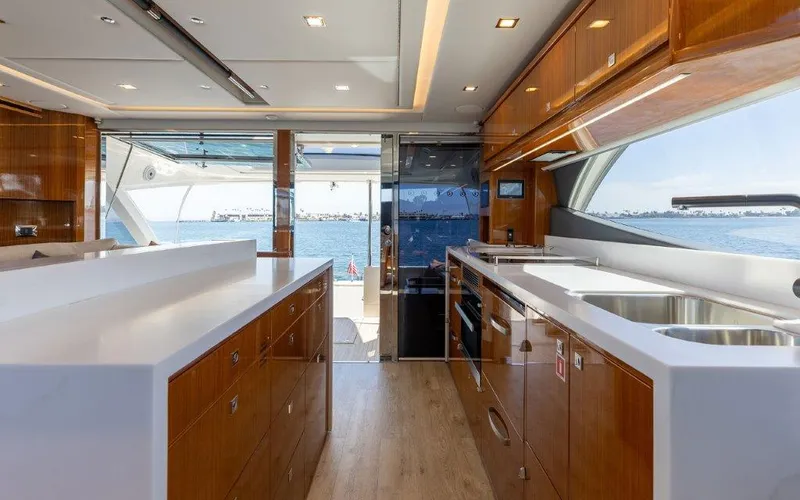 Slide: The Image of Luxurious interior of 2022 Riviera 645 SUV yacht with modern kitchen and ocean view. - 12