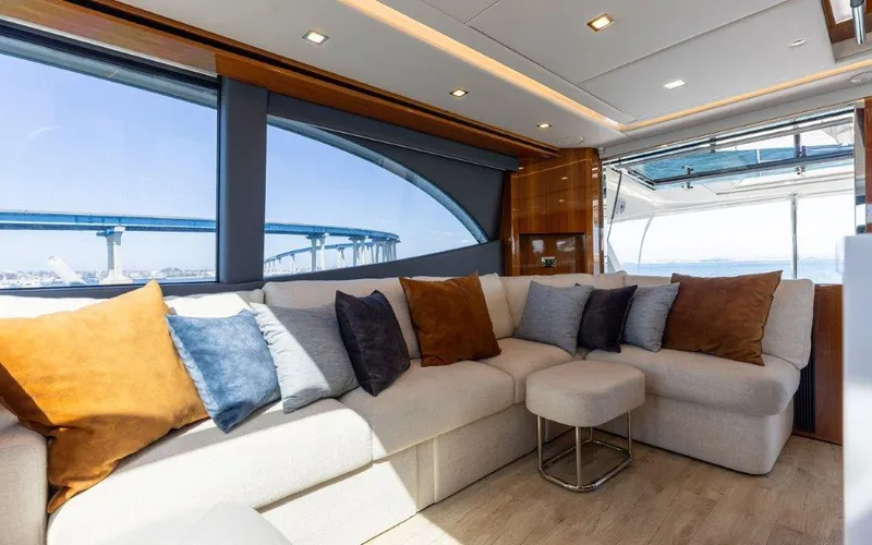 Slide: The Image of Luxurious interior of 2022 Riviera 645 SUV yacht with plush seating and scenic views. - 13
