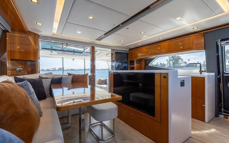 Slide: The Image of Luxurious interior of 2022 Riviera 645 SUV yacht with modern furnishings and scenic views. - 15