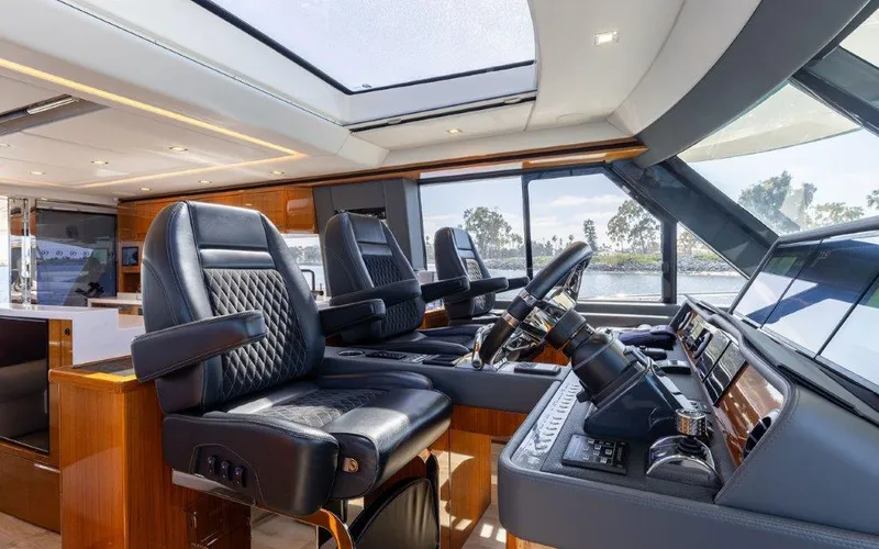 Slide: The Image of Luxurious interior of 2022 Riviera 645 SUV yacht with leather seating and modern controls. - 17
