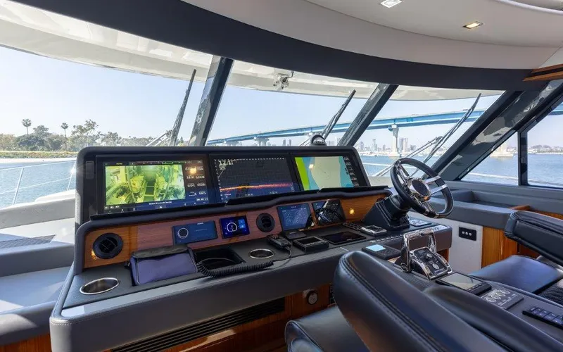 Slide: The Image of Luxurious 2022 Riviera 645 SUV yacht cockpit with advanced navigation systems and panoramic views. - 18