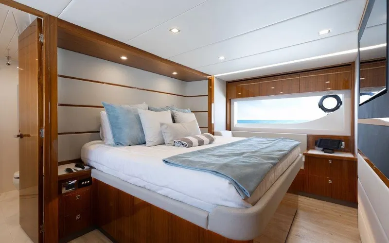 Slide: The Image of Luxurious bedroom interior of 2022 Riviera 645 SUV yacht with modern design and ocean view. - 20