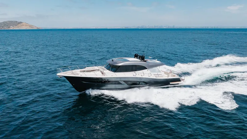 Slide: The Image of 2022 Riviera 645 SUV yacht cruising on open blue ocean waters. - 3