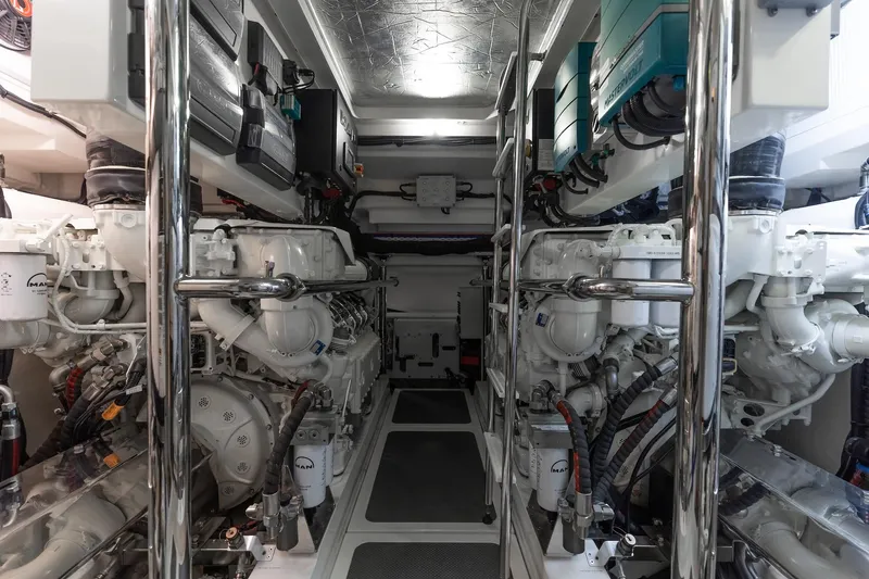 Slide: The Image of Engine room of 2022 Riviera 645 SUV yacht, showcasing advanced machinery and equipment. - 32