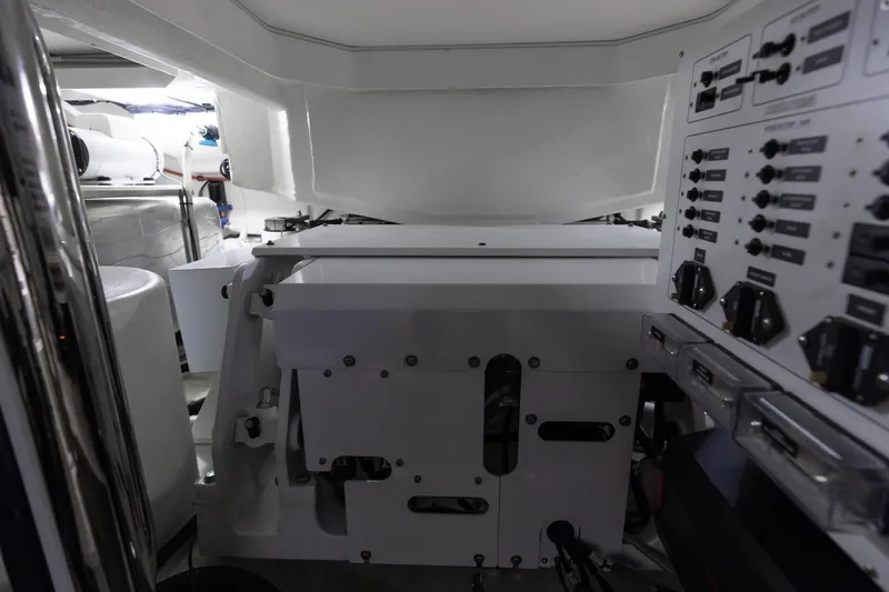 Slide: The Image of 2022 Riviera 645 SUV engine room with control panels and mechanical components. - 33