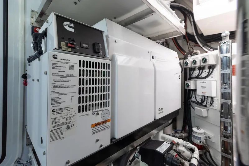 Slide: The Image of Engine room of 2022 Riviera 645 SUV with Cummins generator and electrical systems. - 34