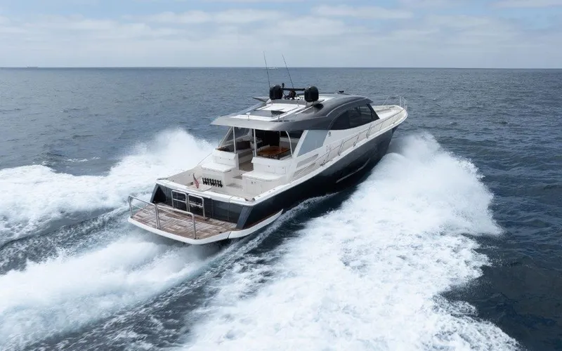 Slide: The Image of Riviera 645 SUV 2022 yacht cruising on open sea, creating waves. - 36