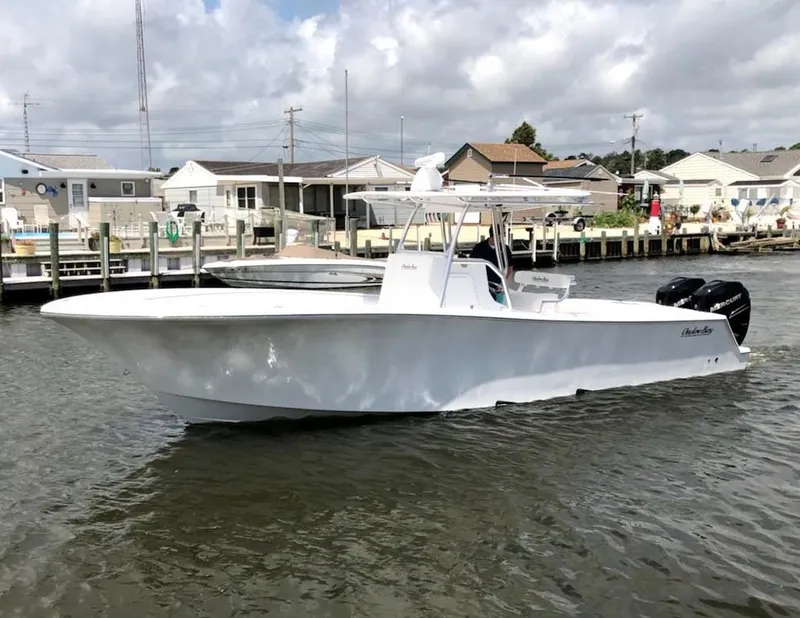 Slide: The Image of 2019 Onslow Bay 33 Tournament boat docked in a marina under cloudy skies. - 0