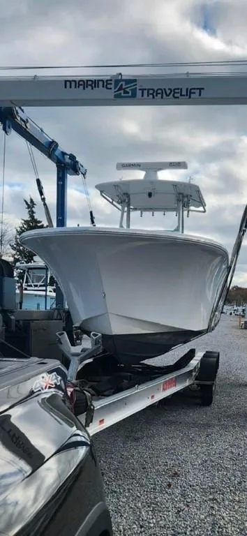 Slide: The Image of 2019 Onslow Bay 33 Tournament boat on trailer under Marine Travelift. - 10