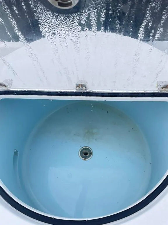 Slide: The Image of Livewell on a 2019 Onslow Bay 33 Tournament boat, featuring a clean, blue interior. - 13