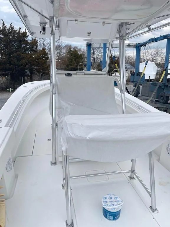 Slide: The Image of 2019 Onslow Bay 33 Tournament boat interior with covered seating and open deck. - 14