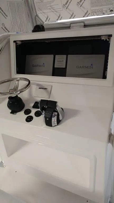 Slide: The Image of 2019 Onslow Bay 33 Tournament helm with Garmin displays and controls. - 18