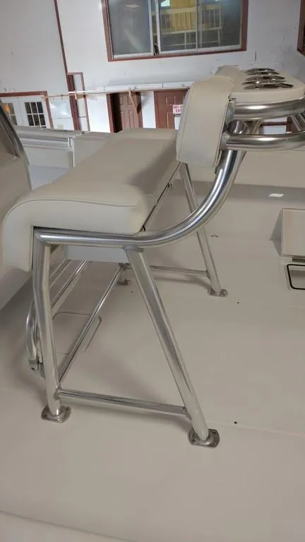Slide: The Image of 2019 Onslow Bay 33 Tournament boat seating with stainless steel frame and white cushions. - 20