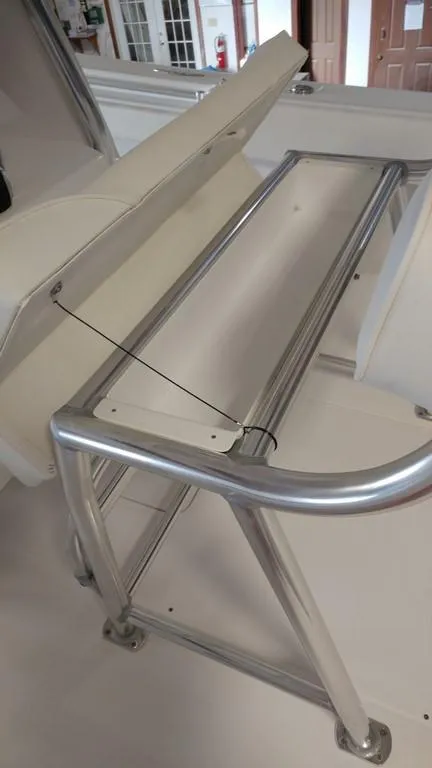 Slide: The Image of 2019 Onslow Bay 33 Tournament boat interior with sleek metal frame and storage compartment. - 22