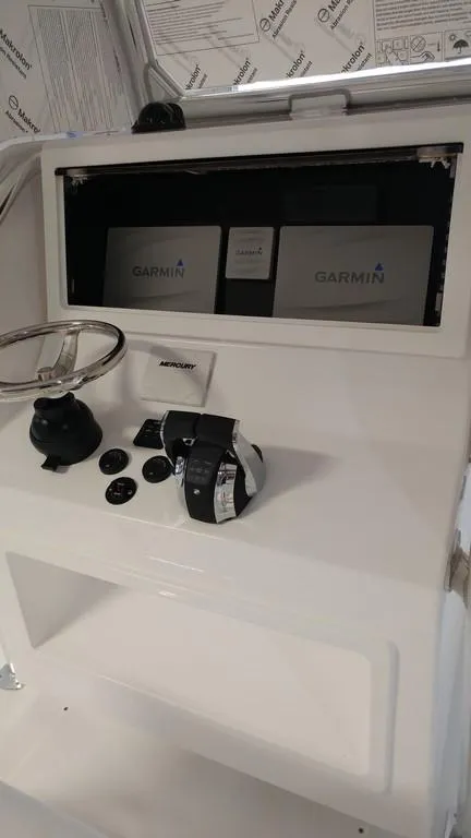 Slide: The Image of 2019 Onslow Bay 33 Tournament boat dashboard with Garmin navigation system. - 25