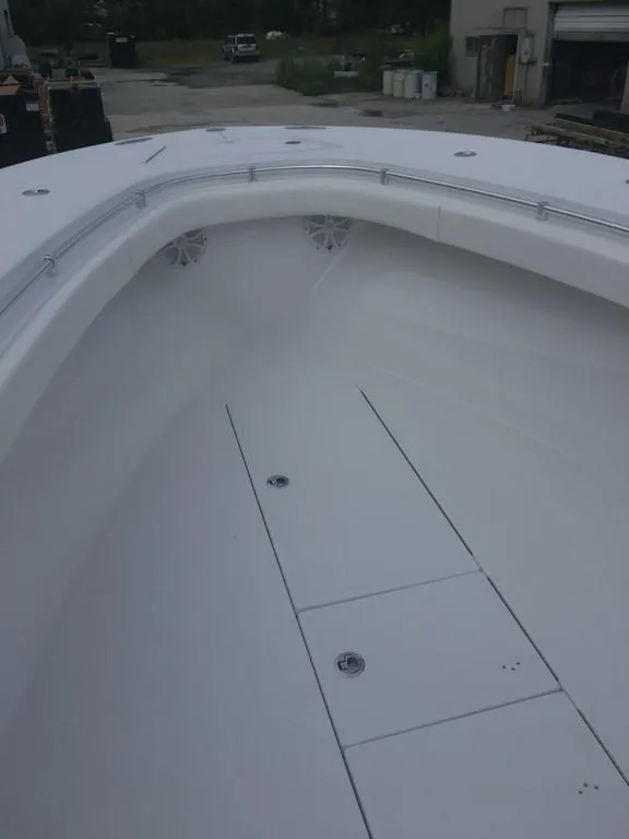 Slide: The Image of 2019 Onslow Bay 33 Tournament boat interior, showcasing spacious deck and storage compartments. - 28