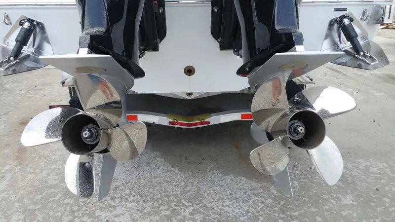 Slide: The Image of 2019 Onslow Bay 33 Tournament boat with dual propellers on a concrete surface. - 41
