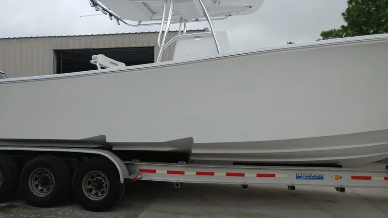 Slide: The Image of 2019 Onslow Bay 33 Tournament boat on trailer, side view. - 45