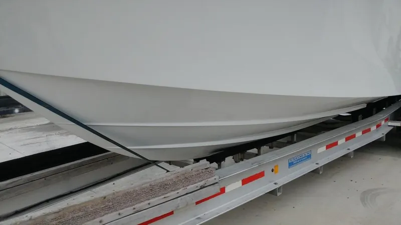 Slide: The Image of 2019 Onslow Bay 33 Tournament boat hull on a trailer. - 47