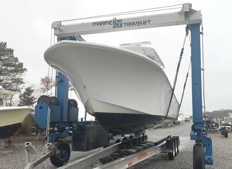Slide: The Image of 2019 Onslow Bay 33 Tournament boat on a Marine Travelift. - 5