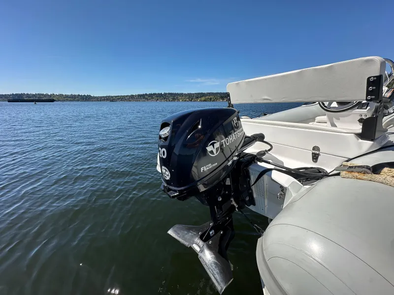Slide: The Image of Outboard motor on a 2004 Sea Ray 340 Sundancer, cruising on a sunny lake. - 12