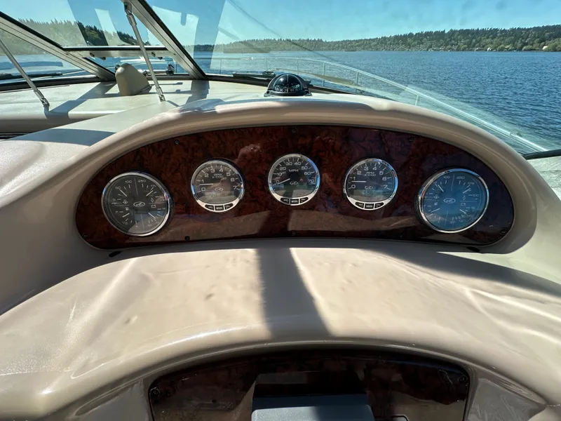 Slide: The Image of Dashboard of 2004 Sea Ray 340 Sundancer boat with gauges, on a sunny day. - 27
