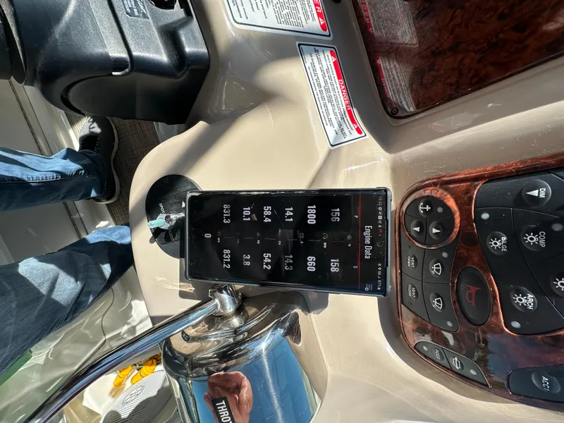 Slide: The Image of Control panel of a 2004 Sea Ray 340 Sundancer boat with digital display and controls. - 28