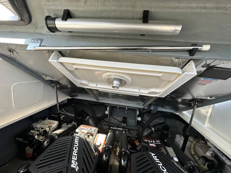 Slide: The Image of Engine compartment of a 2004 Sea Ray 340 Sundancer with Mercury engines. - 43