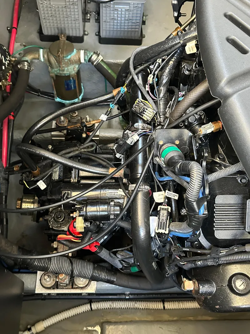 Slide: The Image of Engine compartment of a 2004 Sea Ray 340 Sundancer boat, showcasing wiring and components. - 45