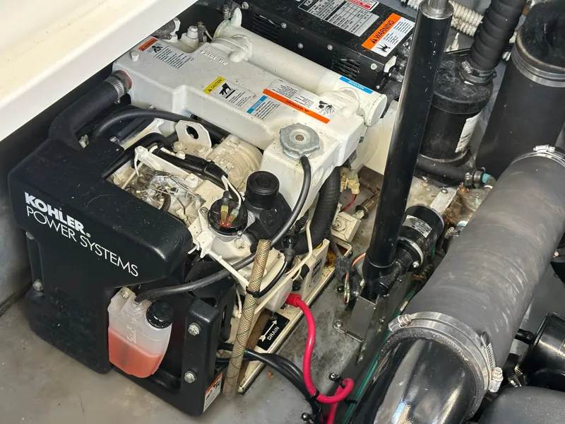 Slide: The Image of Engine compartment of 2004 Sea Ray 340 Sundancer with Kohler power system. - 46
