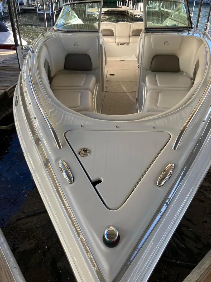 Slide: The Image of 2006 Crownline 270 BR boat with spacious seating and sleek design. - 5