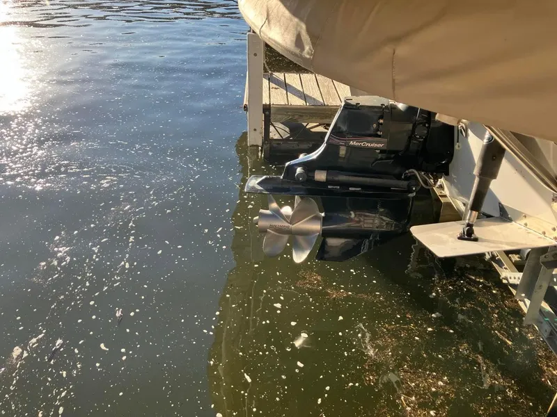 Slide: The Image of 2006 Crownline 270 BR boat with MerCruiser engine docked by water. - 9