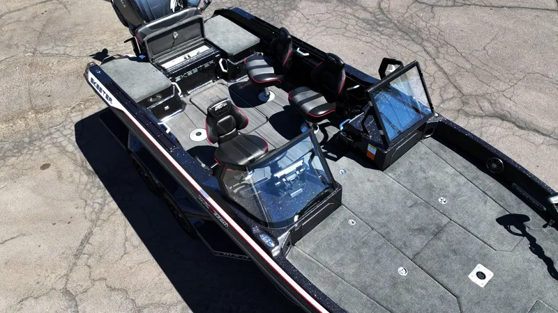 Slide: The Image of 2025 Skeeter WXR2260 boat with spacious seating and modern design on a concrete surface. - 10