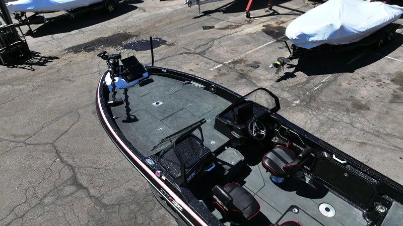Slide: The Image of 2025 Skeeter WXR2260 boat in a parking lot, featuring a sleek design and modern equipment. - 11