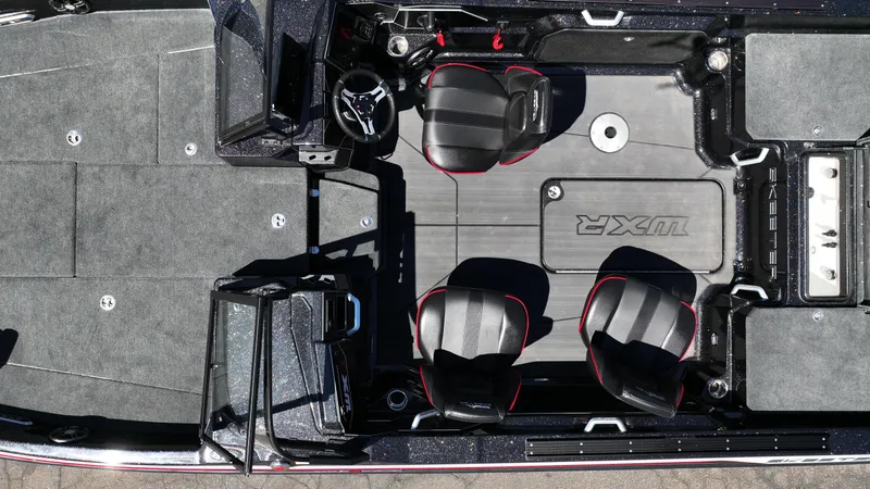 Slide: The Image of 2025 Skeeter WXR2260 boat interior with dual seats and steering console, top view. - 3