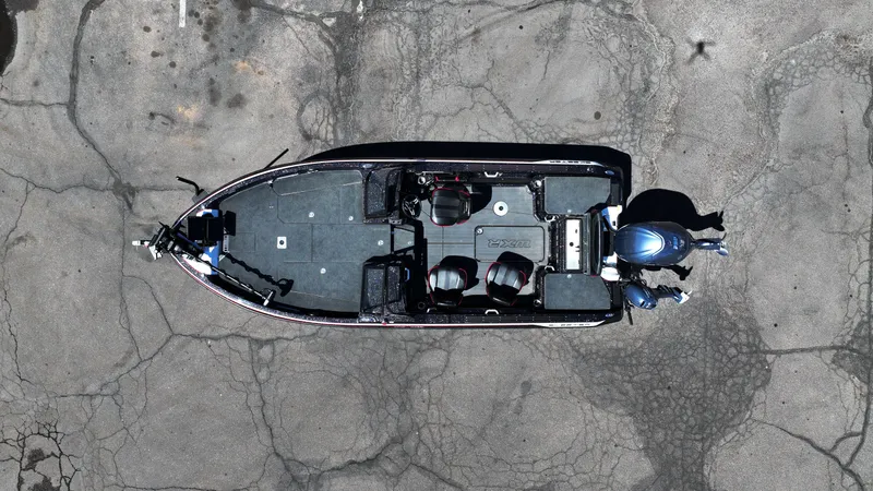 Slide: The Image of Overhead view of 2025 Skeeter WXR2260 boat on cracked pavement. - 9