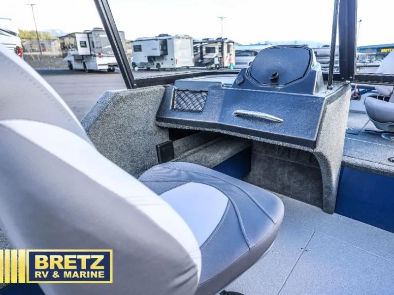 Slide: The Image of 2025 Excursion 176 DC boat interior with seating and control panel at Bretz RV & Marine. - 14